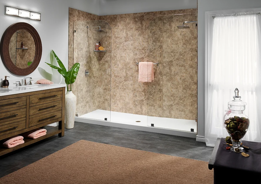 Walk-in shower with frameless glass doors, brown stone-look wall panels, dual showerheads and a white shower base