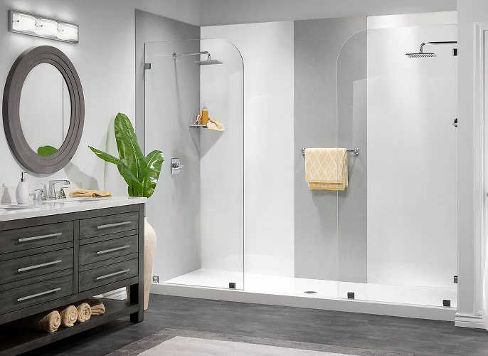 Walk-in shower with white and gray wall panels and clear glass doors